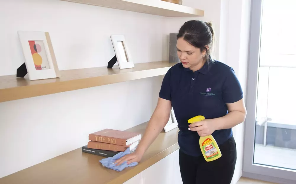 United Facilities cleaner maintaining a client’s modern interior